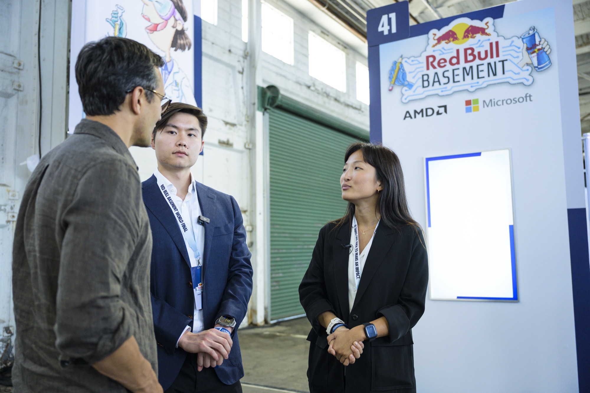 The NeuroSense team speaking with an attendee at the Red Bull Basement World Final Demo Gallery